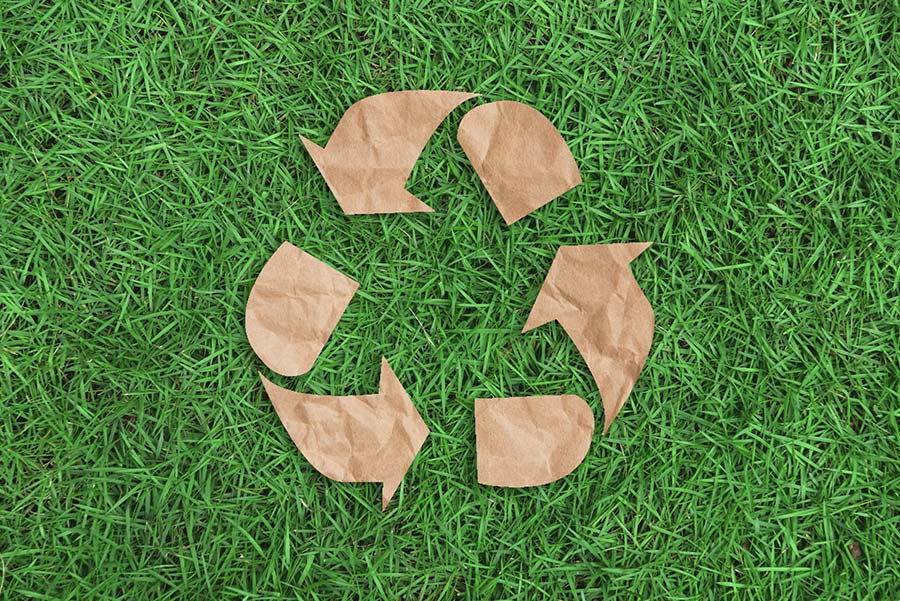 Recycle symbol on grass